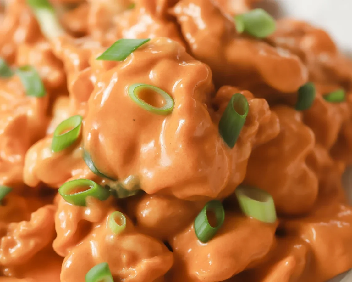 Crispy Bang Bang Chicken served with a spicy dipping sauce on a plate